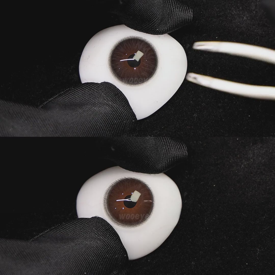 A simulated brown prosthetic eye showing the visual transformation effect of wearing diamond gray colored contact lenses against a black background.