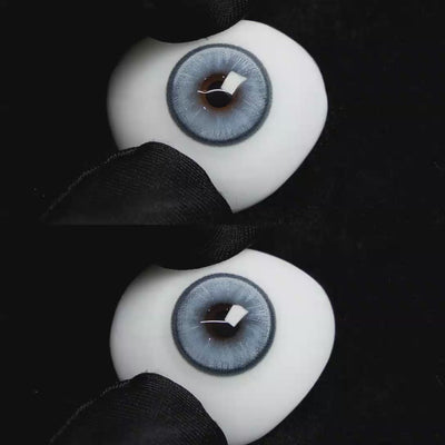 A simulated brown prosthetic eye showing the visual transformation effect of wearing Wooeye Boston Blue colored contact lenses against a black background.