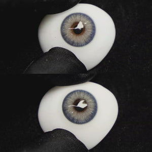 A simulated brown prosthetic eye showing the visual transformation effect of wearing Wooeye Banshe Brown colored contact lenses against a black background.