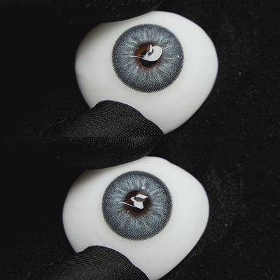 jennie blue contact lenses on a brown simulated eyeball with a black background