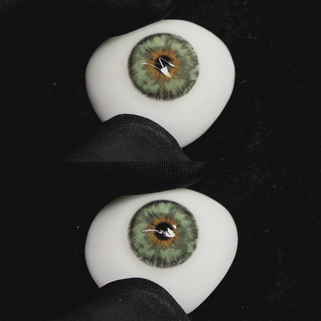 Mermaid Green contact lenses on a brown simulated eyeball with a black background