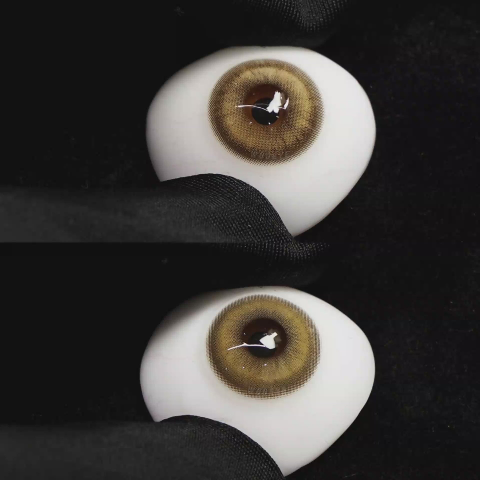 A simulated brown prosthetic eye showing the visual transformation effect of wearing Wooeye Amber Brown colored contact lenses against a black background.