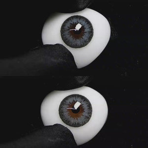 A simulated brown prosthetic eye showing the visual transformation effect of wearing Wooeye Queen Olive Green colored contact lenses against a black background.