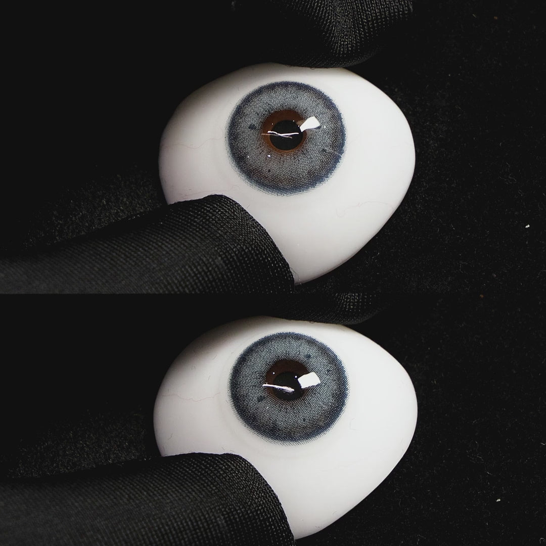 Magic Blue contact lenses on a brown simulated eyeball with a black background
