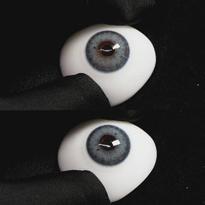 Magic Blue contact lenses on a brown simulated eyeball with a black background
