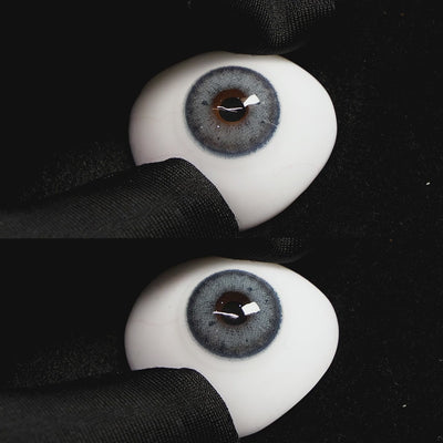 Magic Blue contact lenses on a brown simulated eyeball with a black background