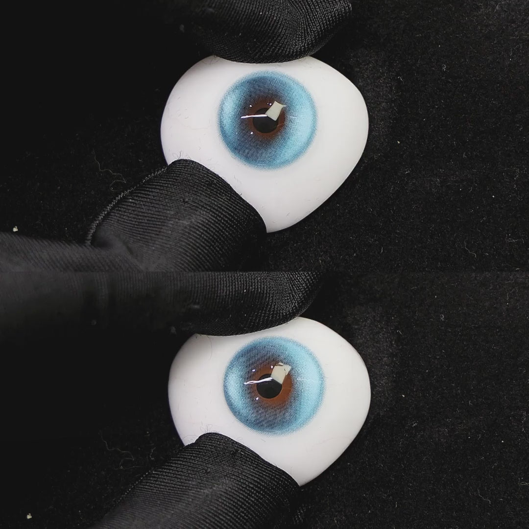 A simulated brown prosthetic eye showing the visual transformation effect of wearing halo pro blue colored contact lenses against a black background.