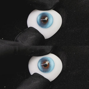 A simulated brown prosthetic eye showing the visual transformation effect of wearing halo pro blue colored contact lenses against a black background.